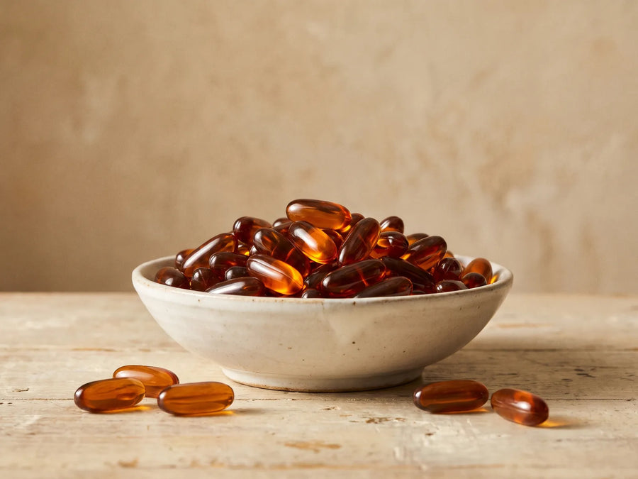 Bowl of amber softgels