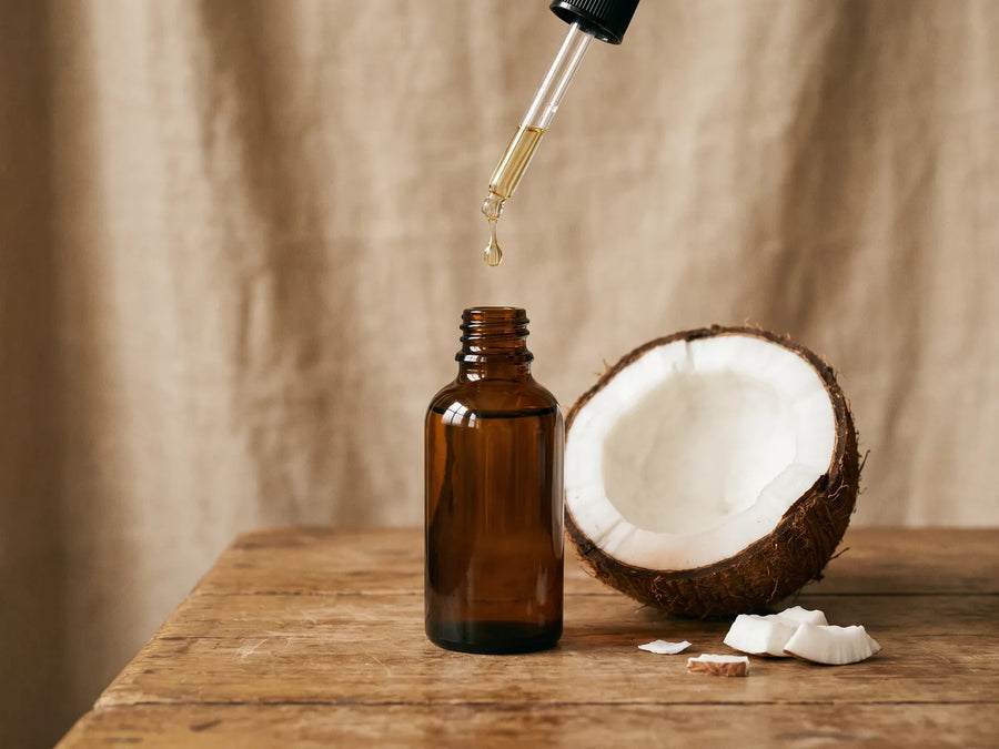 MCT oil dropper bottle and coconut